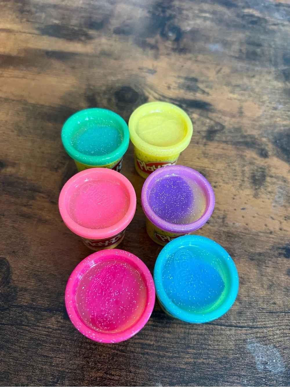 Play-Doh small Yellow with Pink, Teal, Purple, and Green Lids comes with all